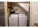 Efficient laundry area featuring a washer and dryer, and floral wallpaper detail at 26 Stonewall Way, Durham, NC 27704