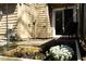 Outdoor patio featuring a raised garden bed with blooming flowers near a back door at 26 Stonewall Way, Durham, NC 27704