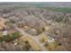 An aerial view of the property showcasing its location within a wooded neighborhood at 2670 Turner Rd, Mebane, NC 27302