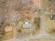 Birds eye view of a home, a road, and wooded area in a residential neighborhood at 2670 Turner Rd, Mebane, NC 27302