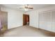 Spacious bedroom with neutral carpet, fan and light fixture, and double-door closet at 2670 Turner Rd, Mebane, NC 27302