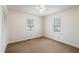 Bright bedroom with two windows, neutral carpet, and double-door closet at 2670 Turner Rd, Mebane, NC 27302