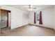 Cozy bedroom featuring neutral carpet, window with purple curtains, and double-door closet at 2670 Turner Rd, Mebane, NC 27302