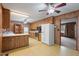 A practical kitchen with wood paneling, ample cabinetry, and modern appliances at 2670 Turner Rd, Mebane, NC 27302