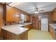 Traditional kitchen with wood cabinets, laminate countertops, and vintage yellow pattern flooring at 2670 Turner Rd, Mebane, NC 27302