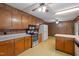 Traditional kitchen with wood cabinets, laminate countertops, and vintage yellow pattern flooring at 2670 Turner Rd, Mebane, NC 27302