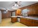 Traditional kitchen with wood cabinets, laminate countertops, and vintage yellow pattern flooring at 2670 Turner Rd, Mebane, NC 27302