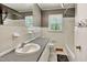 Bathroom featuring tiled walls, vanity, and a tub, designed for comfort and functionality at 2700 Chub Lake Rd, Roxboro, NC 27574