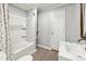 Bathroom featuring a shower-tub combo, white vanity sink, and a clean, functional layout at 2700 Chub Lake Rd, Roxboro, NC 27574