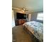 Bedroom with a TV and large window allowing for natural light and showing the spacious layout at 2700 Chub Lake Rd, Roxboro, NC 27574