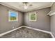 A cozy bedroom featuring carpeted floors, neutral walls, and natural light at 2700 Chub Lake Rd, Roxboro, NC 27574