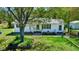 Charming single-story home with a well-maintained lawn and mature trees in a serene, wooded setting at 2700 Chub Lake Rd, Roxboro, NC 27574