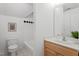 Bathroom featuring a white sink, and black and white tiled shower/bath at 2900 Old Trafford Way, Raleigh, NC 27606