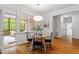 Bright breakfast nook with hardwood floors and access to the screened-in porch at 2900 Old Trafford Way, Raleigh, NC 27606