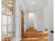 Bright entryway featuring hardwood floors, elegant moldings and a sidelight window at 2900 Old Trafford Way, Raleigh, NC 27606