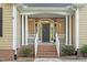 Charming front entrance with stone facade, brick steps, and covered porch at 2900 Old Trafford Way, Raleigh, NC 27606