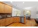 Kitchen area showcasing stainless steel dishwasher and hardwood flooring at 2900 Old Trafford Way, Raleigh, NC 27606