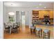 Eat-in kitchen with an island with bar stool seating, a breakfast nook and wood cabinets at 2900 Old Trafford Way, Raleigh, NC 27606