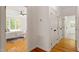 View of the main bedroom from the hallway with hardwood floors at 2900 Old Trafford Way, Raleigh, NC 27606