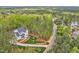 Beautiful craftsman style home with a manicured lawn and a long driveway at 30 Mist Wood Ct, Pittsboro, NC 27312