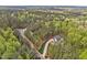 An aerial view showcasing a stunning home site among mature trees and landscaping at 30 Mist Wood Ct, Pittsboro, NC 27312