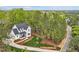 Breathtaking aerial view showcasing the property's serene location surrounded by lush greenery and mature trees at 30 Mist Wood Ct, Pittsboro, NC 27312