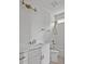 Bright bathroom featuring white tile, modern fixtures, and a shower-tub combo at 30 Mist Wood Ct, Pittsboro, NC 27312