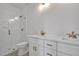 Stylish bathroom featuring double sinks, modern fixtures, and a glass-enclosed shower at 30 Mist Wood Ct, Pittsboro, NC 27312