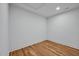 Minimalist bedroom design with hardwood floors, white walls, and a clean, spacious layout at 30 Mist Wood Ct, Pittsboro, NC 27312