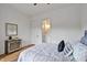 Bedroom features a bed with decorative pillows and a stylish dresser at 30 Mist Wood Ct, Pittsboro, NC 27312