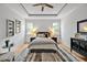 Comfortable bedroom with tray ceiling, soft bedding, and neutral decor for relaxation at 30 Mist Wood Ct, Pittsboro, NC 27312