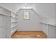 Spacious closet with custom shelving and hardwood floors, offering ample storage at 30 Mist Wood Ct, Pittsboro, NC 27312