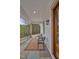 Cozy front porch with stylish furniture, offering a welcoming space to unwind and enjoy the scenic view at 30 Mist Wood Ct, Pittsboro, NC 27312