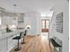 Bright and open kitchen featuring sleek white cabinets, a large center island, and modern stainless steel appliances at 30 Mist Wood Ct, Pittsboro, NC 27312