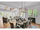 A bright and open living room connects to a dining area, providing a cozy and inviting space with natural light at 30 Mist Wood Ct, Pittsboro, NC 27312