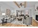 This bright living room flows seamlessly into the dining area and modern kitchen for easy entertaining and comfortable living at 30 Mist Wood Ct, Pittsboro, NC 27312