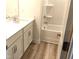 Bathroom featuring modern vanity, sink and a shower with tub at 3007 Cypress Lagoon Ct, Durham, NC 27703