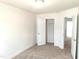 A simple, carpeted bedroom with a closet ready for personalization at 3007 Cypress Lagoon Ct, Durham, NC 27703