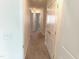 Hallway with neutral paint and multiple doors at 3007 Cypress Lagoon Ct, Durham, NC 27703