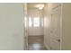 Bright hallway with hardwood floors leading to a white front door at 3007 Cypress Lagoon Ct, Durham, NC 27703