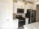 Kitchen featuring stainless steel appliances, white cabinets and granite countertops at 3007 Cypress Lagoon Ct, Durham, NC 27703