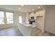 Modern kitchen with white cabinets, granite countertops, and stainless steel appliances at 3007 Cypress Lagoon Ct, Durham, NC 27703