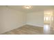 A spacious living room featuring hardwood floors and ample natural light at 3007 Cypress Lagoon Ct, Durham, NC 27703