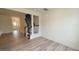 Open-concept living room and hallway with hardwood floors and staircase at 3007 Cypress Lagoon Ct, Durham, NC 27703