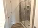 Bathroom with glass shower and tiled walls at 3007 Cypress Lagoon Ct, Durham, NC 27703