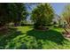 Spacious backyard with a lush green lawn and well-placed trees, offering a private outdoor retreat at 308 Grove Hall Ln, Mebane, NC 27302