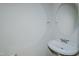 Bright bathroom features a pedestal sink, chrome faucet, and a round mirror at 308 Grove Hall Ln, Mebane, NC 27302