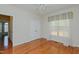 Bedroom with wood floors, closet, window with curtains, and ceiling fan at 308 Grove Hall Ln, Mebane, NC 27302