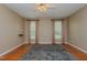 Spacious bedroom features hardwood floors, neutral walls, and multiple windows at 308 Grove Hall Ln, Mebane, NC 27302