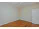 Bedroom featuring ceiling fan, hardwood floors, and white trim at 308 Grove Hall Ln, Mebane, NC 27302